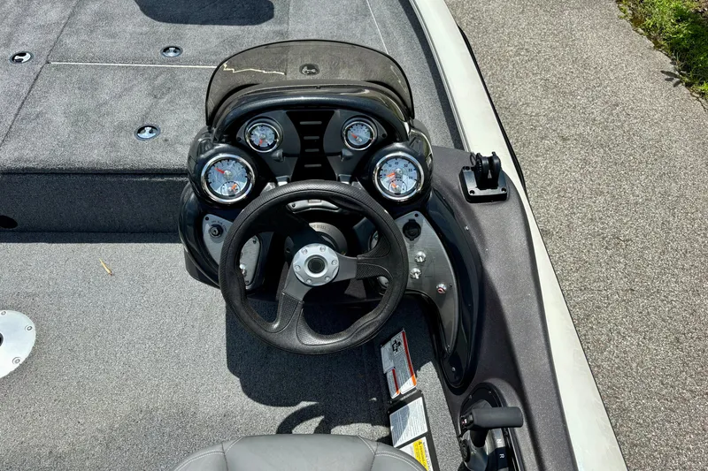 Slide: The Image of 2023 TRACKER MARINE Pro Team 175 TF boat dashboard with steering wheel and gauges. - 7