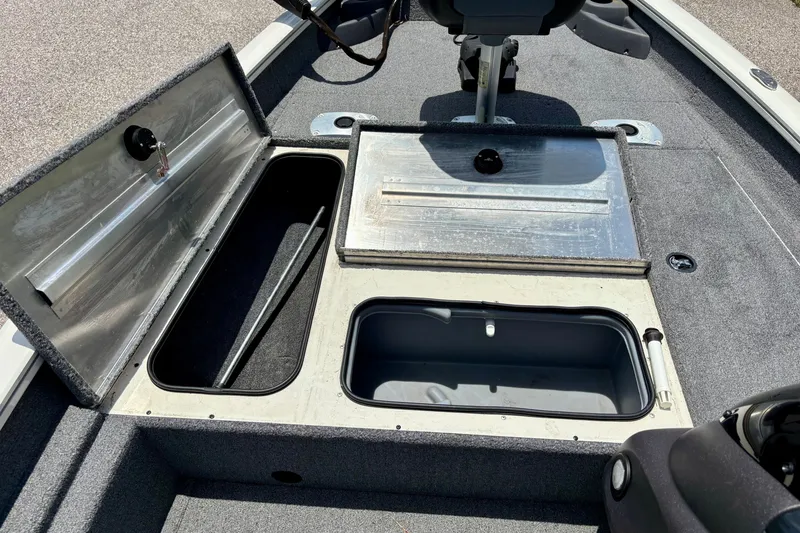 Slide: The Image of 2023 TRACKER MARINE Pro Team 175 TF boat storage compartments open, showcasing interior space. - 11