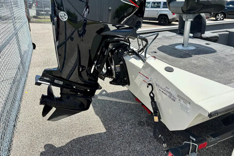 Slide: The Image of 2023 TRACKER MARINE Pro Team 175 TF boat with motor, parked on a trailer. - 4