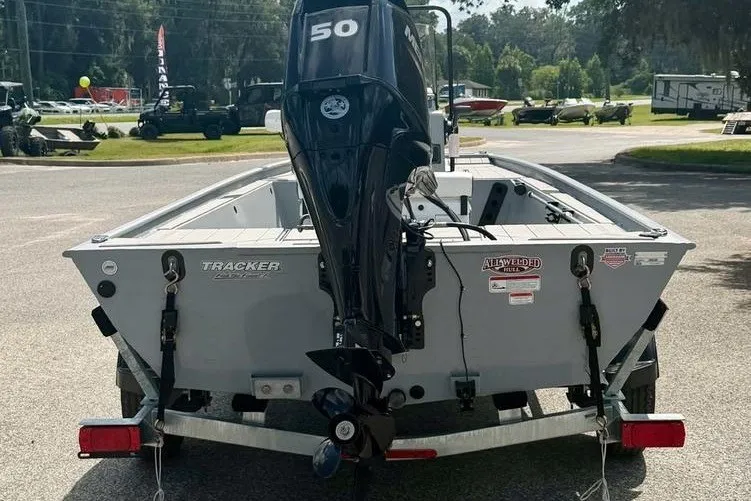 Slide: The Image of 2027 Tracker Bass Tracker Classic CC boat with a 50 HP motor, parked on a trailer. - 6