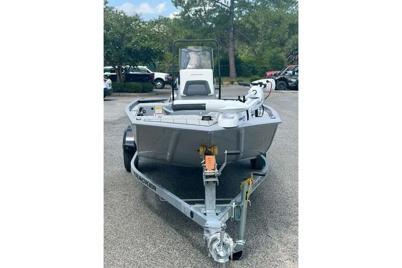 Slide: The Image of 2027 Tracker Bass Tracker Classic CC boat on trailer in parking lot. - 2