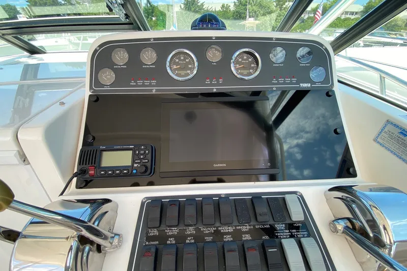 Slide: The Image of Dashboard of a 2006 Tiara Yachts 2900 Open Classic with gauges and Garmin display. - 9