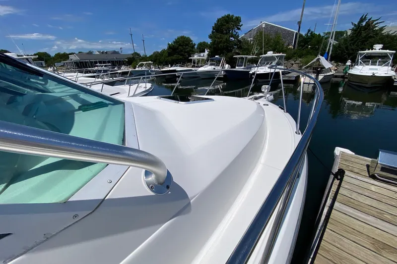 Slide: The Image of 2006 Tiara Yachts 2900 Open Classic docked at marina under clear blue sky. - 20