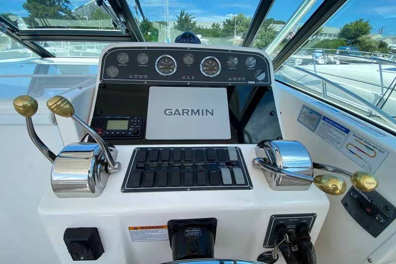 Slide: The Image of Helm of 2006 Tiara Yachts 2900 Open Classic with Garmin navigation system. - 8