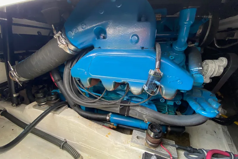 Slide: The Image of Engine compartment of a 2006 Tiara Yachts 2900 Open Classic, showcasing blue engine components. - 33