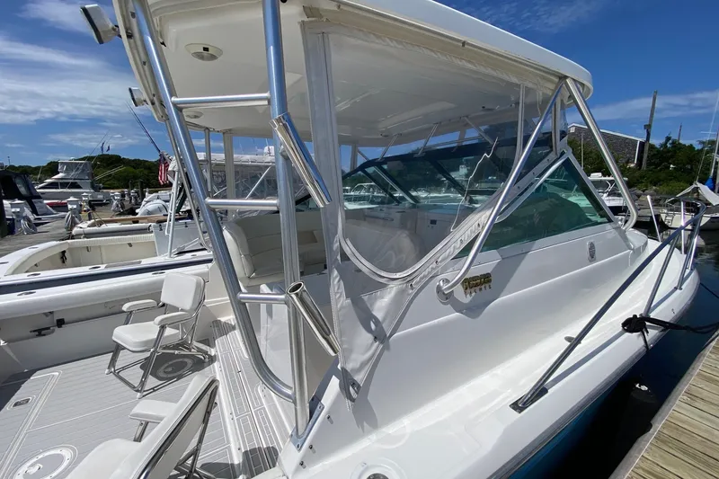 Slide: The Image of 2006 Tiara Yachts 2900 Open Classic docked, showcasing sleek design and spacious deck. - 7