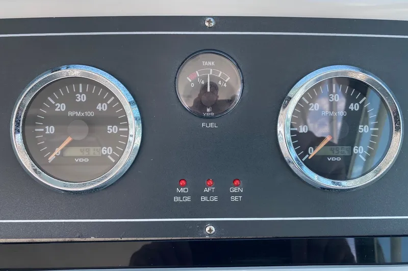 Slide: The Image of Dashboard of a 2006 Tiara Yachts 2900 Open Classic, featuring RPM and fuel gauges. - 10