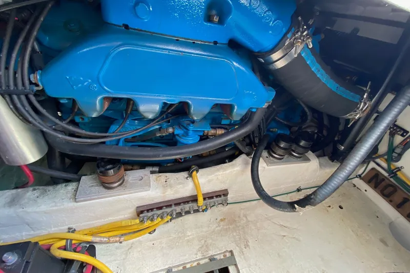 Slide: The Image of Engine compartment of a 2006 Tiara Yachts 2900 Open Classic, showcasing blue engine components. - 32