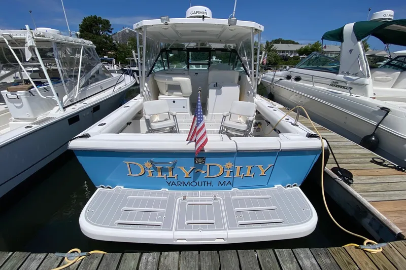 Slide: The Image of 2006 Tiara Yachts 2900 Open Classic docked, featuring "Dilly-Dilly" name and American flag. - 4