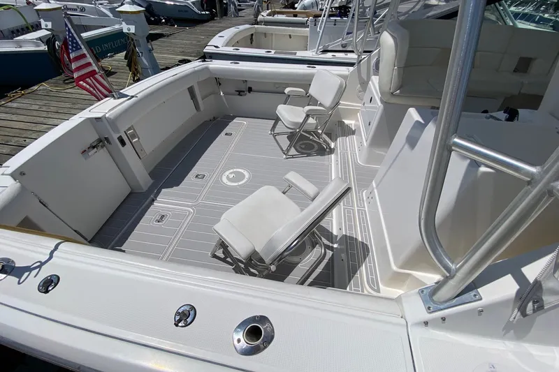 Slide: The Image of 2006 Tiara Yachts 2900 Open Classic boat deck with seating, docked at marina. - 17