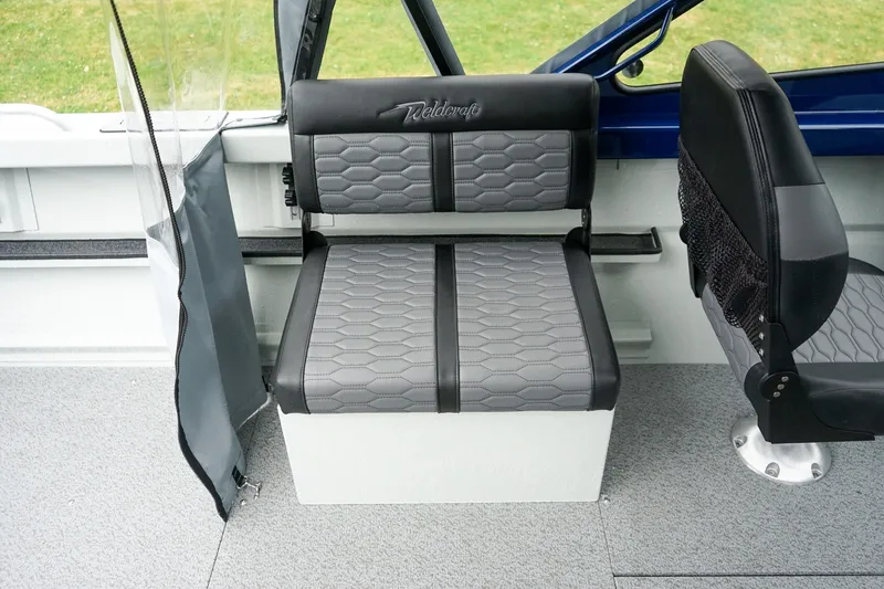 Slide: The Image of 2027 Weldcraft 180 Rebel boat interior with gray and black seating, showcasing modern design. - 15