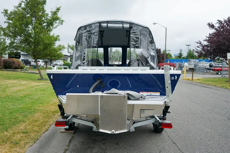 Slide: The Image of 2027 Weldcraft 180 Rebel boat on trailer, parked on a suburban street. - 4