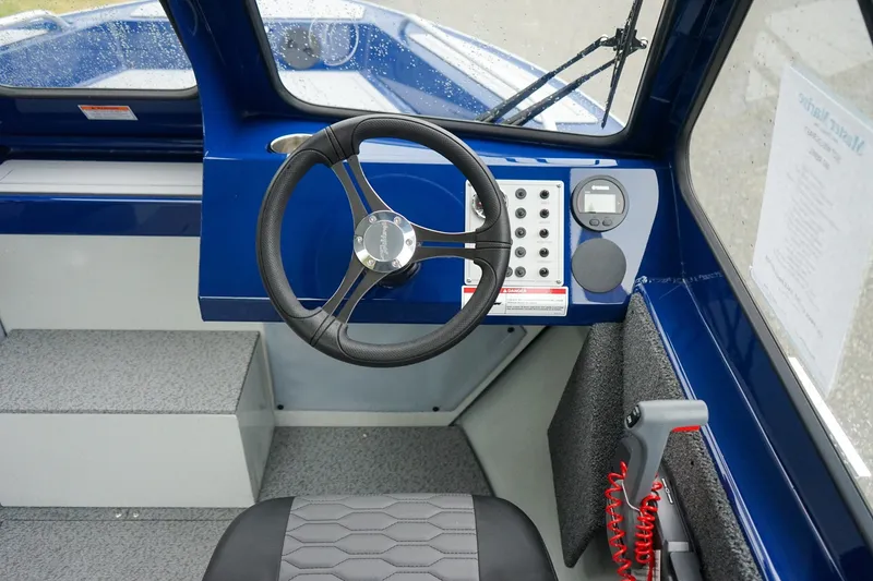 Slide: The Image of Interior view of 2027 Weldcraft 180 Rebel boat cockpit with steering wheel and controls. - 18