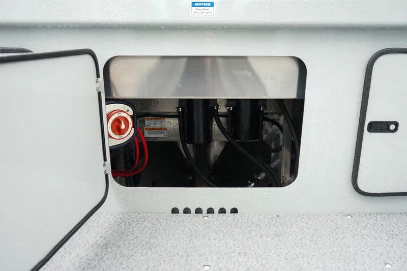 Slide: The Image of Open compartment of 2027 Weldcraft 180 Rebel boat showing internal components and wiring. - 10