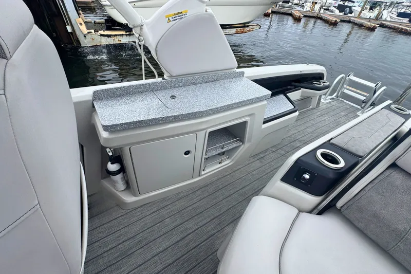 Slide: The Image of 2022 Avalon Catalina Platinum boat interior with versatile rear bench and storage compartments. - 10