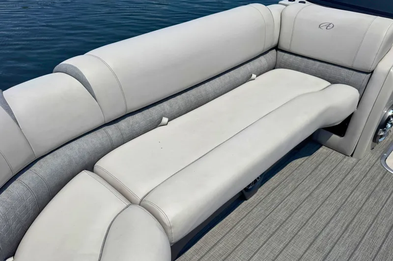 Slide: The Image of 2022 Avalon Catalina Platinum boat with versatile rear bench and windshield on water. - 19