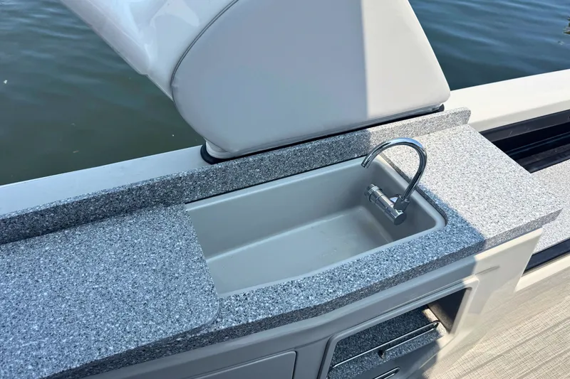 Slide: The Image of 2022 Avalon Catalina Platinum boat sink with granite countertop, featuring a sleek faucet design. - 11