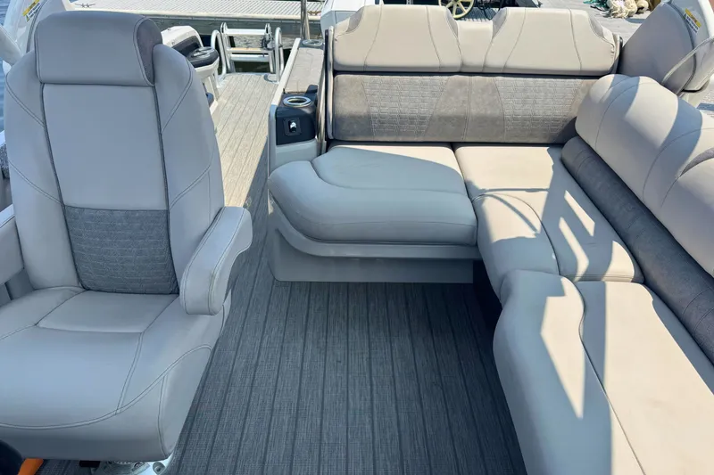 Slide: The Image of 2022 Avalon Catalina Platinum boat interior with versatile rear bench and windshield. - 13