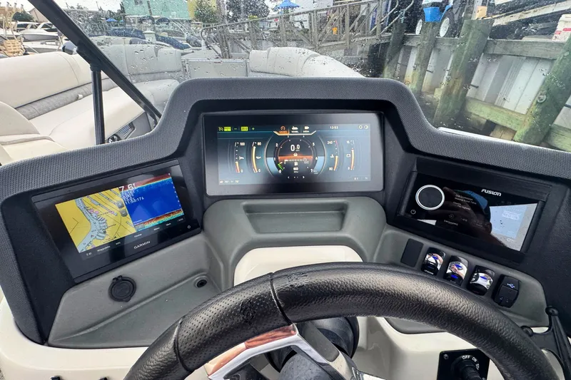 Slide: The Image of 2022 Avalon Catalina Platinum boat dashboard with advanced navigation and control displays. - 17