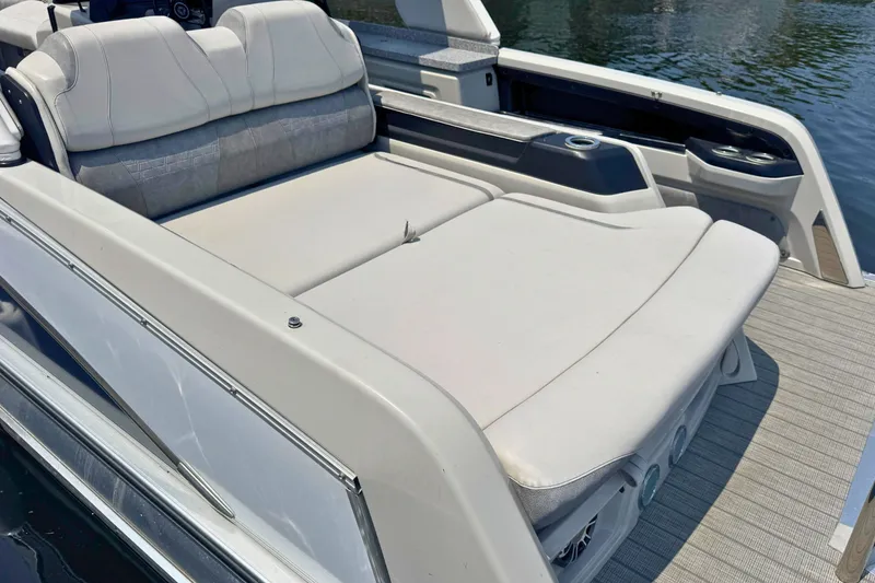 Slide: The Image of 2022 Avalon Catalina Platinum boat with versatile rear bench and windshield on water. - 6
