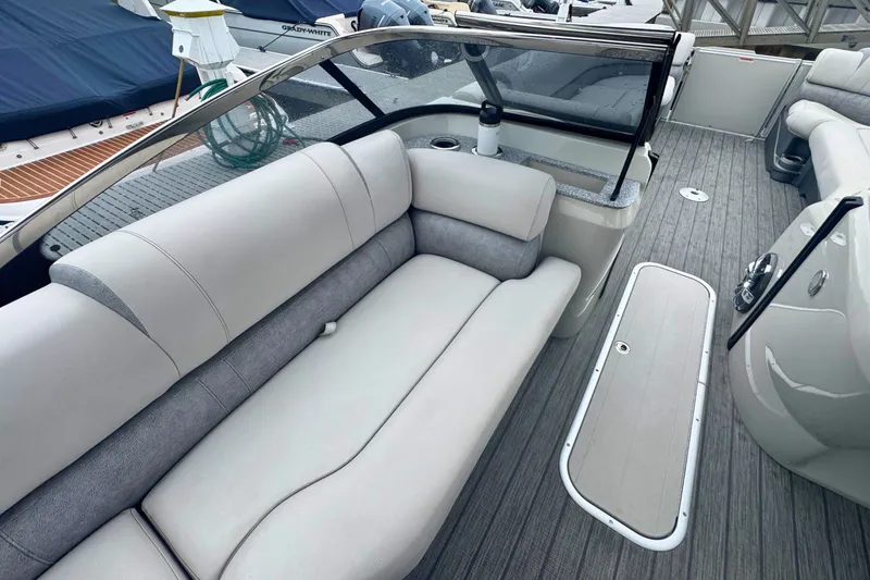 Slide: The Image of 2022 Avalon Catalina Platinum boat interior with versatile rear bench and windshield. - 12