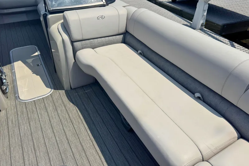 Slide: The Image of 2022 Avalon Catalina Platinum boat with versatile rear bench and windshield, featuring elegant seating. - 20