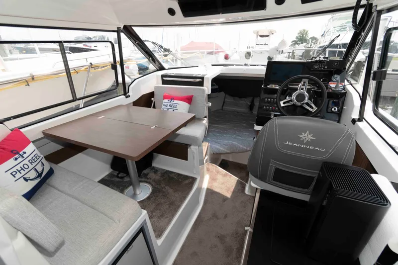 Slide: The Image of Interior of 2024 Jeanneau NC 795 Series 2 boat with seating and helm station. - 9