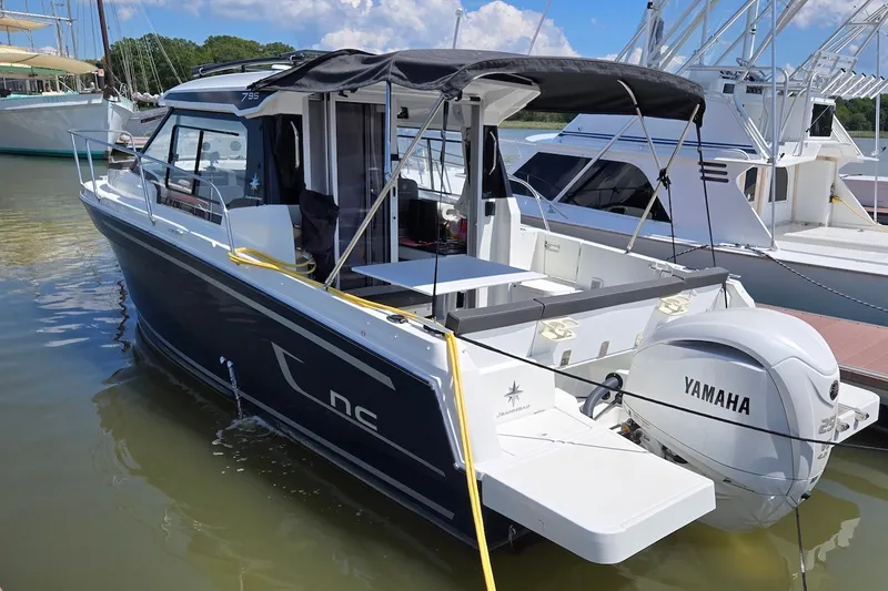 The Image of 2024 Jeanneau NC 795 Series 2 boat docked with Yamaha engine. - 0