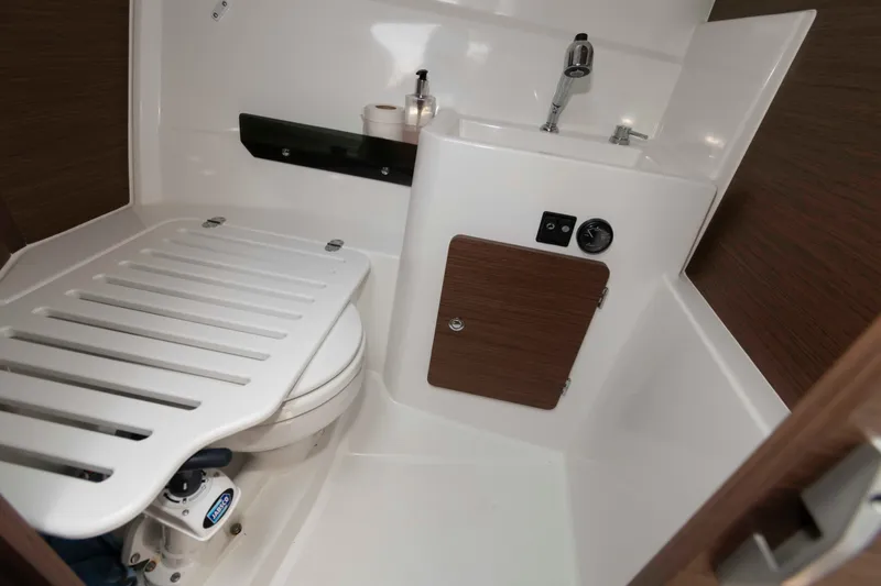 Slide: The Image of 2024 Jeanneau NC 795 Series 2 boat bathroom with sink and toilet. - 17