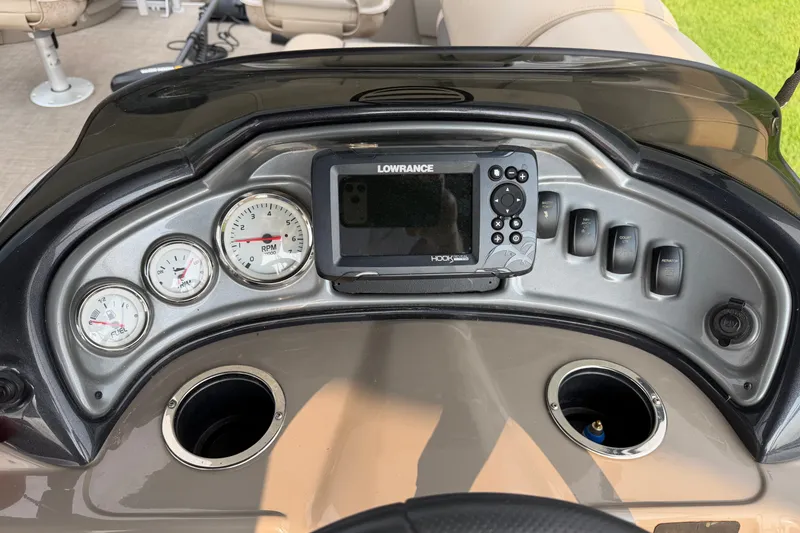 Slide: The Image of Dashboard of 2021 Sun Tracker Fishin' Barge 20 DLX with gauges and Lowrance display. - 19