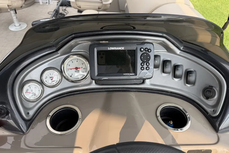 Slide: The Image of Dashboard of 2021 Sun Tracker Fishin' Barge 20 DLX with gauges and Lowrance display. - 10