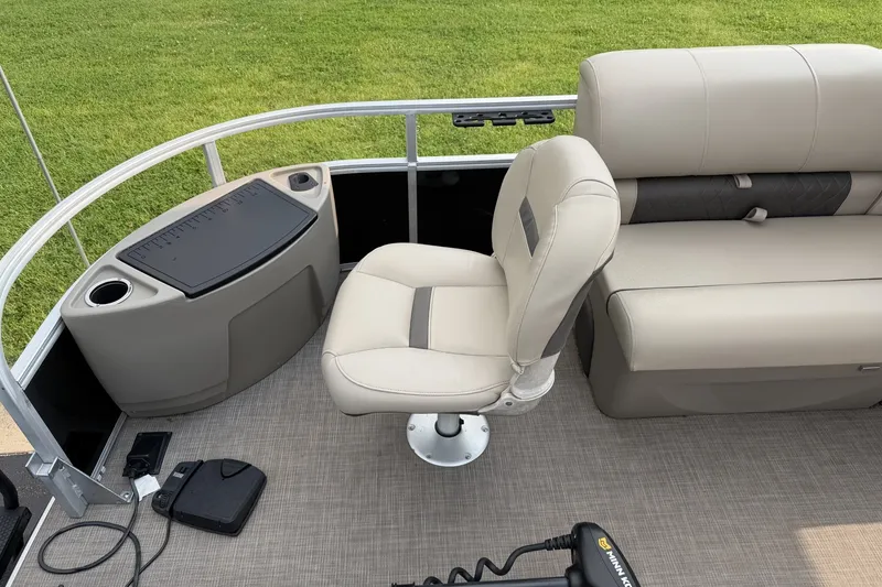 Slide: The Image of 2021 Sun Tracker Fishin' Barge 20 DLX interior with seating and fishing station. - 6