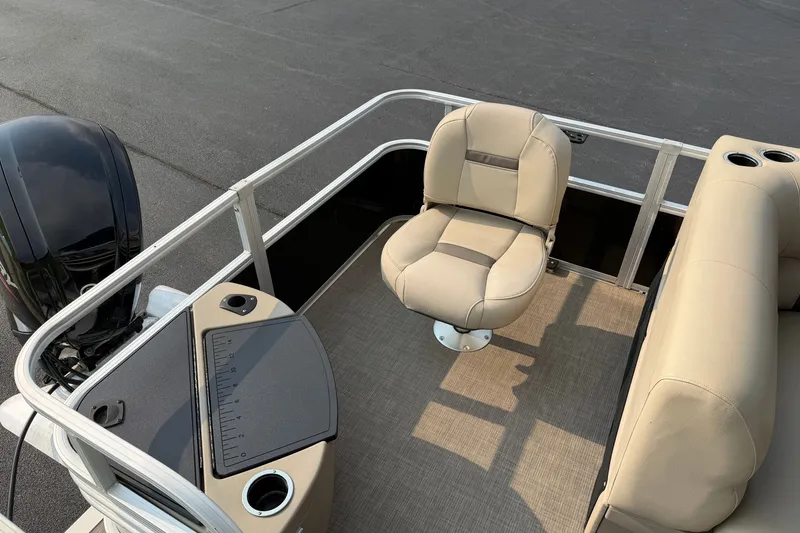Slide: The Image of 2021 Sun Tracker Fishin' Barge 20 DLX interior with seating and fishing station. - 20
