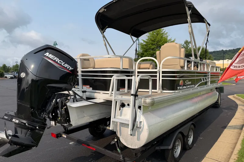 Slide: The Image of 2021 Sun Tracker Fishin' Barge 20 DLX pontoon boat with Mercury outboard motor on trailer. - 34