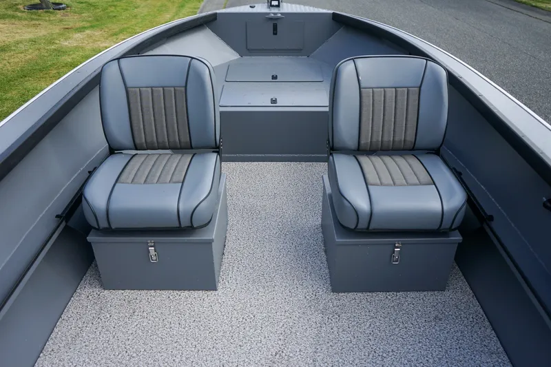 Slide: The Image of 2026 Alumaweld Adventurer 20 boat interior with two gray cushioned seats on storage boxes. - 10