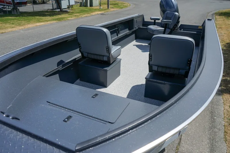 Slide: The Image of 2027 Alumaweld Adventurer 20 boat interior with seating and storage compartments. - 20
