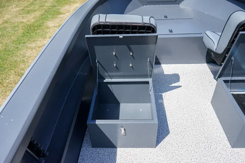 Slide: The Image of 2027 Alumaweld Adventurer 20 boat interior with open storage compartment and seating. - 15