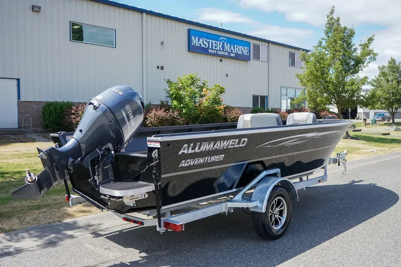 Slide: The Image of 2027 Alumaweld Adventurer 20 boat with Yamaha motor, parked outside Master Marine Boat Center. - 3
