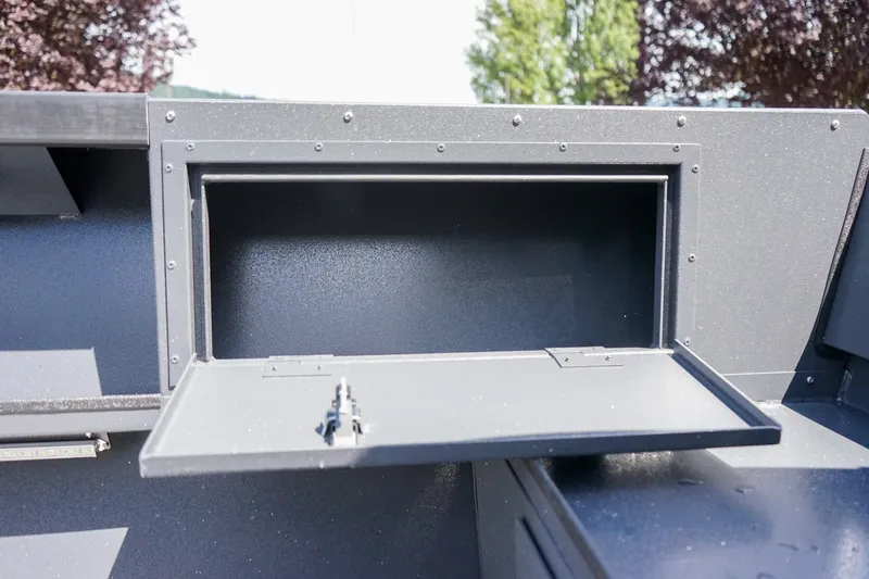 Slide: The Image of Open storage compartment on 2027 Alumaweld Adventurer 20 boat, showcasing interior space. - 8