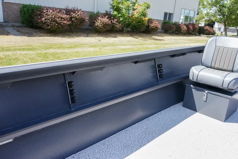 Slide: The Image of 2027 Alumaweld Adventurer 20 boat interior with seating and storage, outdoor setting. - 11