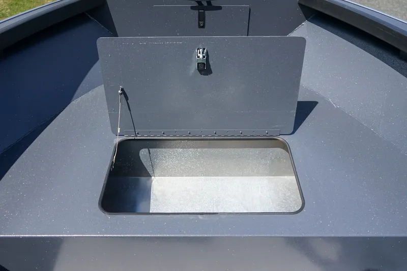 Slide: The Image of 2027 Alumaweld Adventurer 20 boat storage compartment, open lid, metallic finish. - 17
