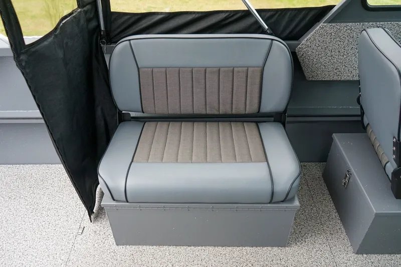 Slide: The Image of 2026 Alumaweld Stryker Sport 202 boat interior seating, featuring gray and black upholstery. - 10