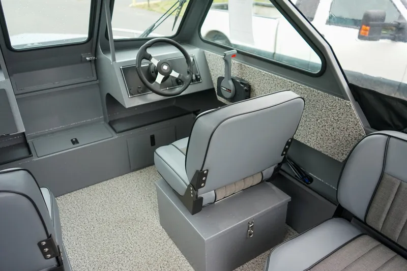 Slide: The Image of Interior of 2026 Alumaweld Stryker Sport 202 boat with steering wheel and seating. - 11