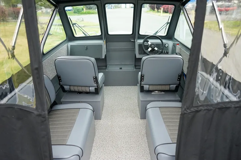 Slide: The Image of Interior of 2026 Alumaweld Stryker Sport 202 boat, featuring seating and steering area. - 8