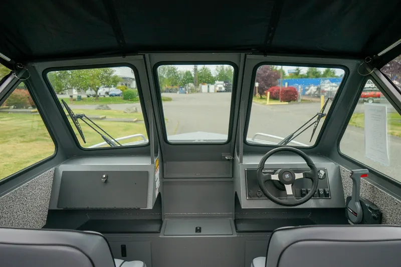 Slide: The Image of Interior view of 2026 Alumaweld Stryker Sport 202 boat cockpit with steering wheel. - 14