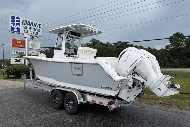 Slide: The Image of 2027 Sea Hunt Ultra 265 SE boat on trailer at Marine Service Center. - 1