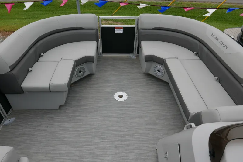 Slide: The Image of 2023 Bennington 21 SXSRC pontoon boat interior with gray seating and flooring. - 7