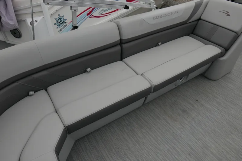 Slide: The Image of 2023 Bennington 21 SXSRC boat interior with sleek gray seating and modern design. - 11