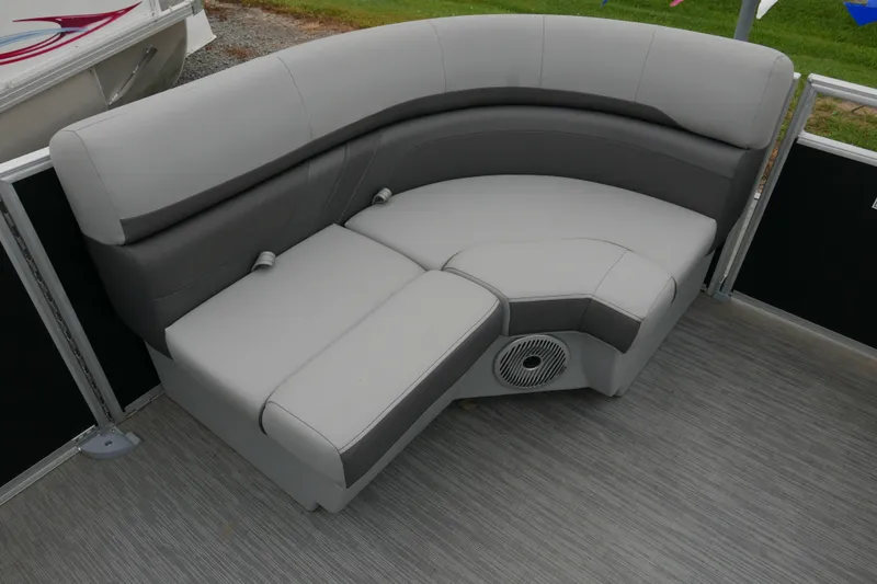 Slide: The Image of 2023 Bennington 21 SXSRC boat interior with gray cushioned seating and speaker. - 6