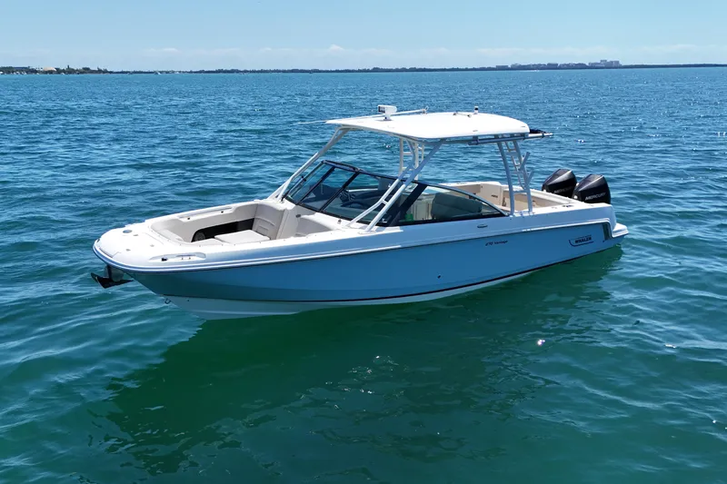 Slide: The Image of 2019 Boston Whaler 270 Vantage boat on calm blue water. - 1
